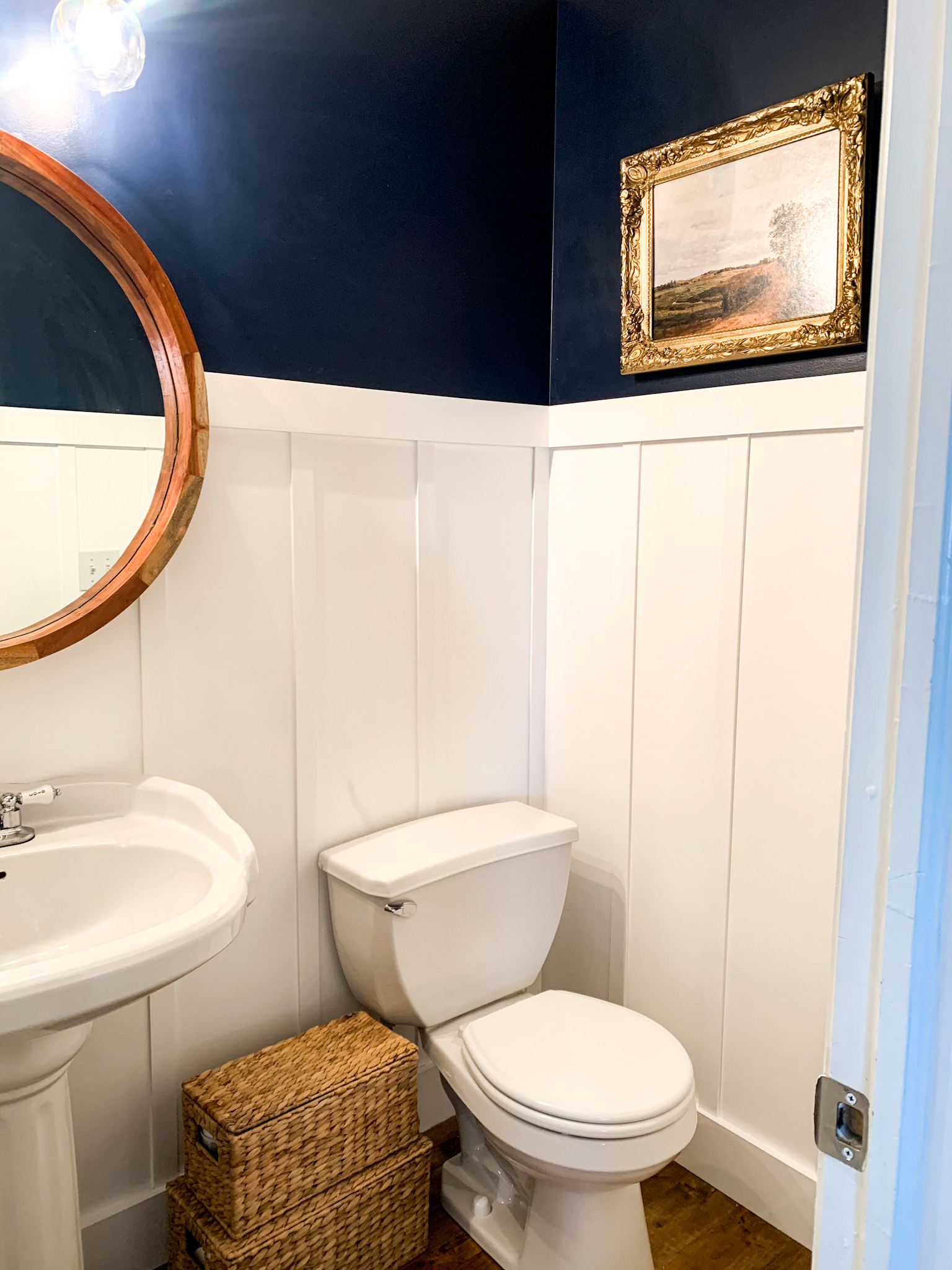 mini bathroom makeover, half bath makeover, navy blue walls, board and batten, gold light, modern bathroom, lnchome, nautical bathroom , diy bathroom makeover,